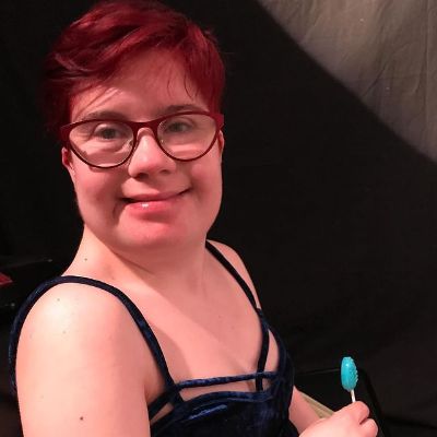 Photo of Krystal Hope Nausbaum while having a lollipop.